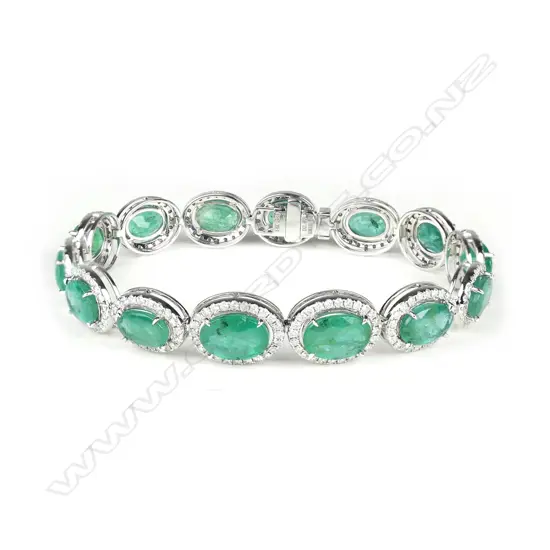 A 14ct white gold emerald and diamond bracelet