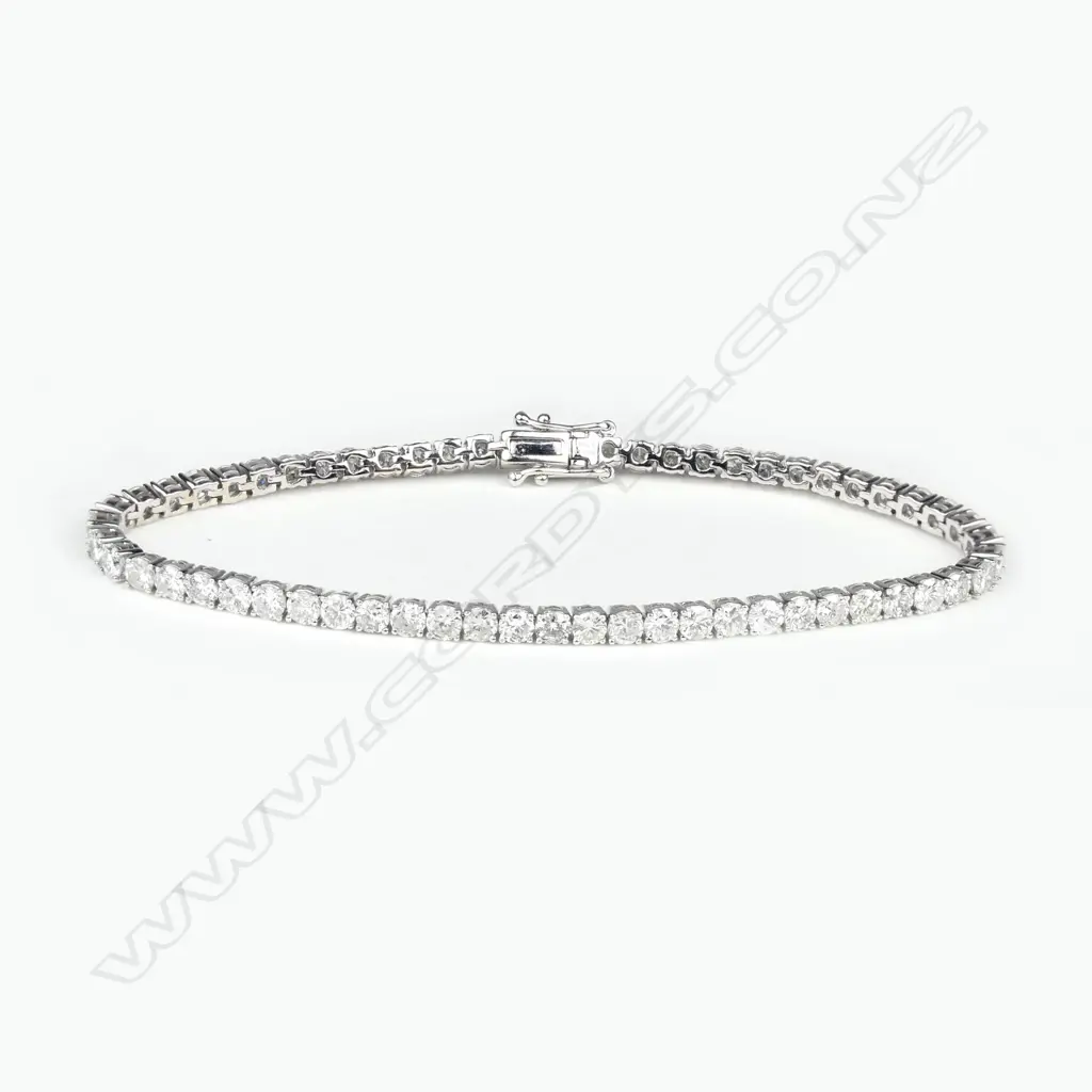 A 14ct white gold and diamond tennis bracelet Image 1++
