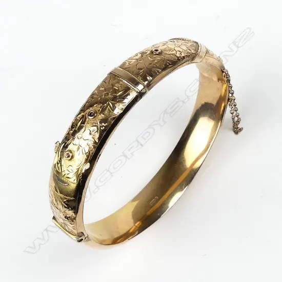 A vintage 9ct rose gold half hinged bangle