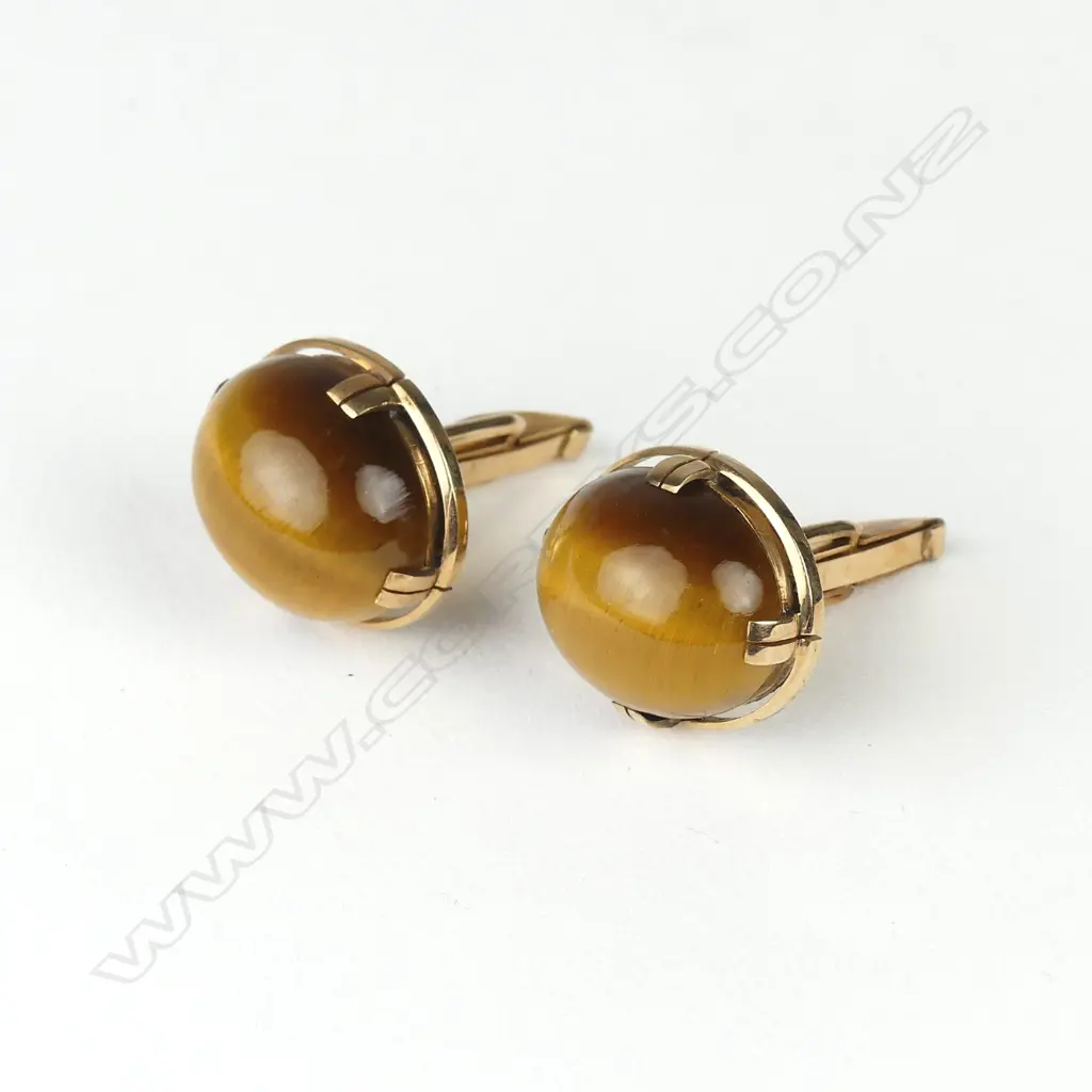 A pair of 9ct rose gold and tiger's eye cufflinks Image 1++