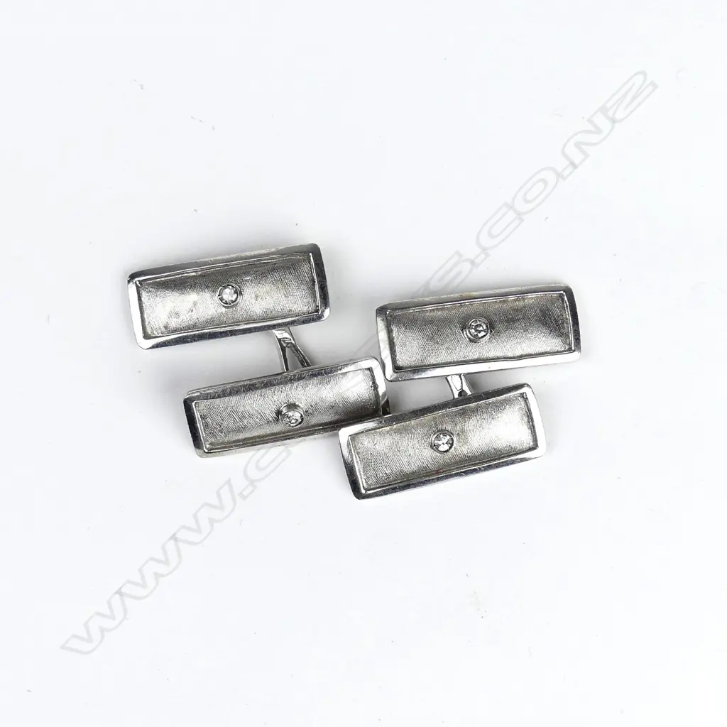 A pair of vintage 18ct. white gold and diamond set cufflinks Image 1++
