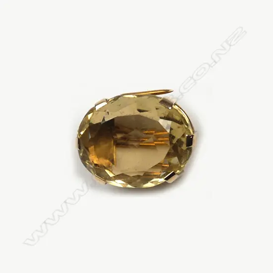 A 1970s large citrine and 9ct. yellow gold brooch