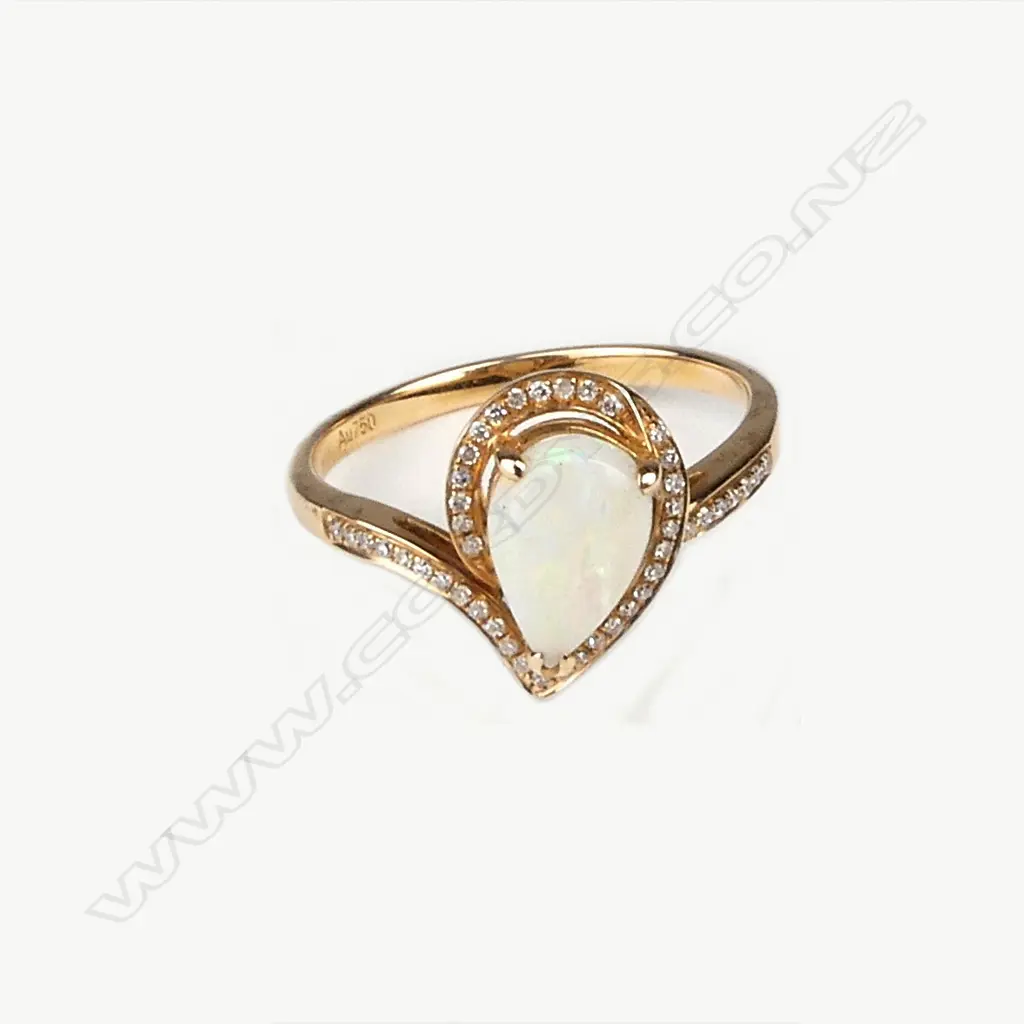 An 18ct. rose gold opal and diamond modern ring Image 1++