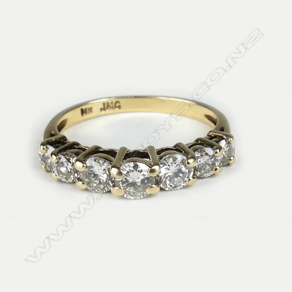 A 14ct yellow gold seven stone diamond ring Image 1++