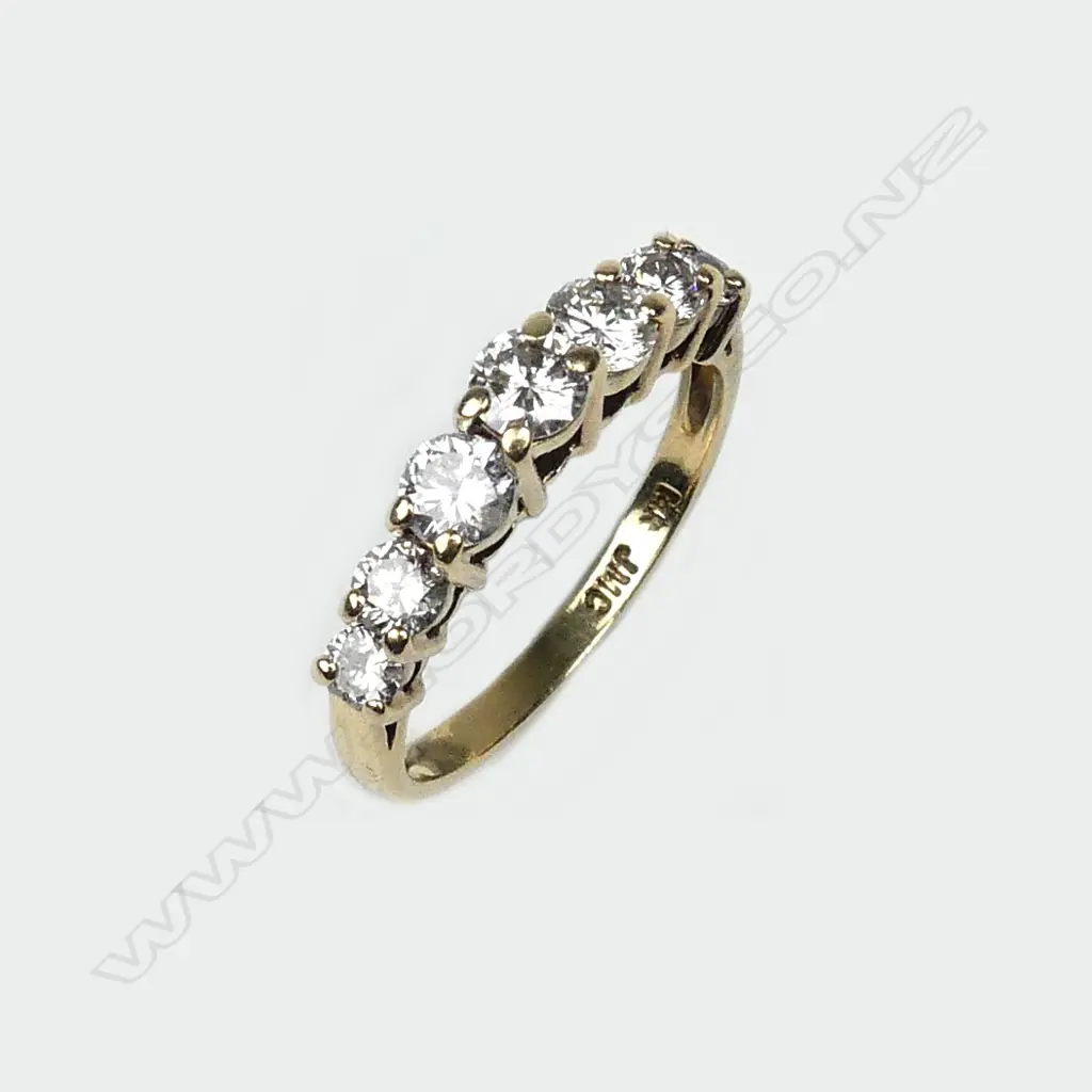 A 14ct yellow gold seven stone diamond ring Image 1++