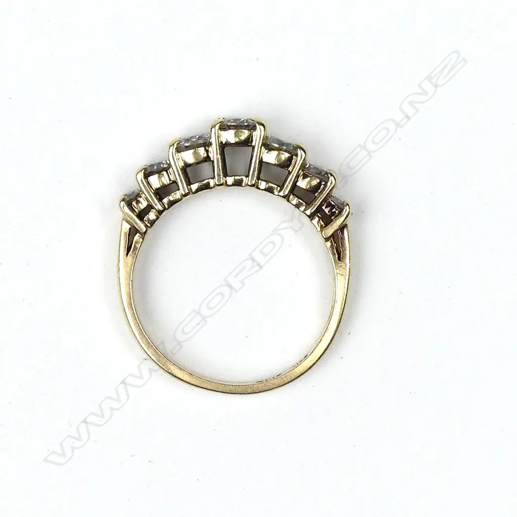A 14ct yellow gold seven stone diamond ring Image 1++