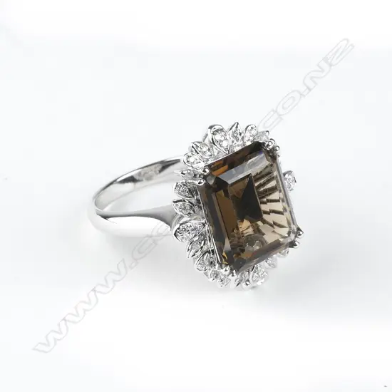 An 18ct. white gold diamond and smoky quartz combination pendant/ring