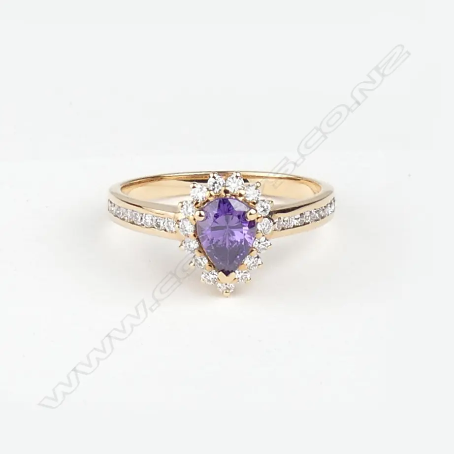 A modern lady's 18ct. rose gold amethyst and diamond ring Image 1++
