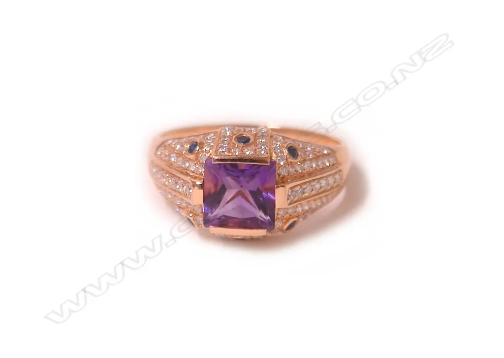 A modern 18ct. rose gold amethyst and diamond dress ring Image 1++