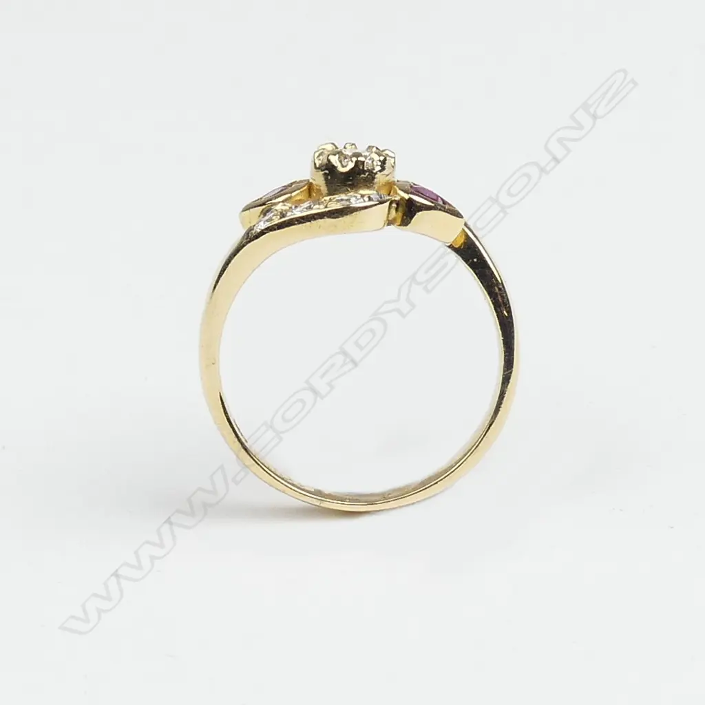 An 18ct. yellow gold ruby and diamond dress ring Image 1++