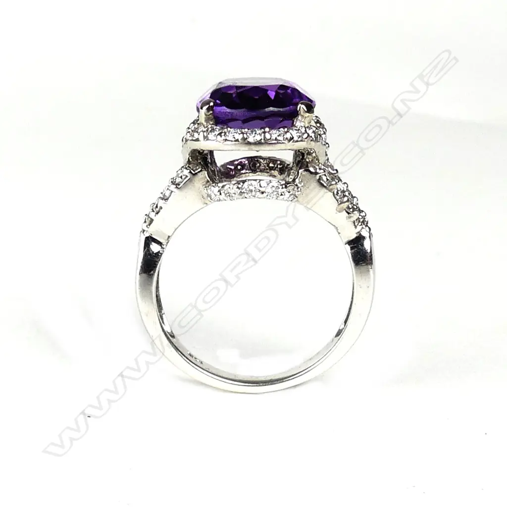 A 14ct. gold modern amethyst and diamond dress ring Image 1++