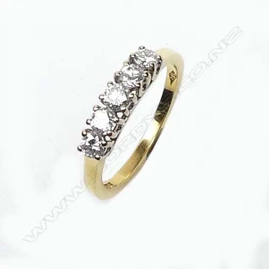 An 18ct gold and five stone diamond ring