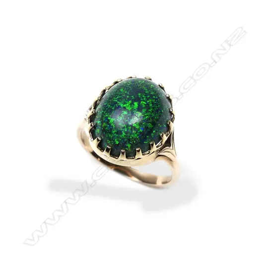 A retro 9ct gold and opal ring