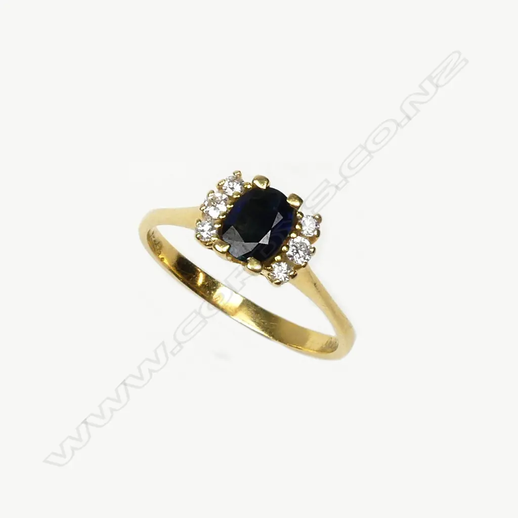 An 18ct gold sapphire and diamond ring Image 1++