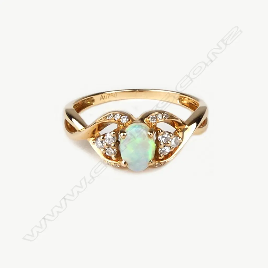 A modern 18ct. rose gold opal and diamond dress ring Image 1++