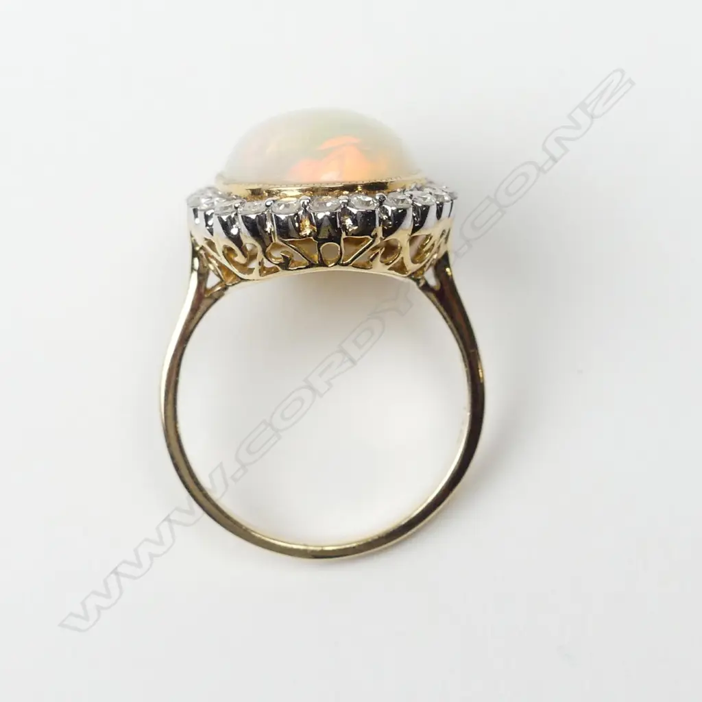 A 14ct yellow gold opal and diamond ring Image 1++