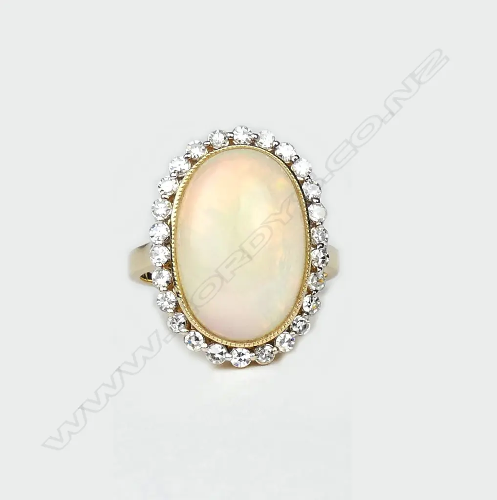 A 14ct yellow gold opal and diamond ring Image 1++