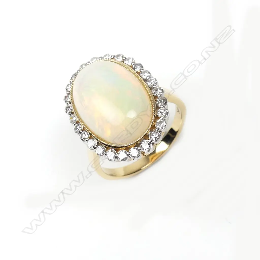 A 14ct yellow gold opal and diamond ring Image 1++