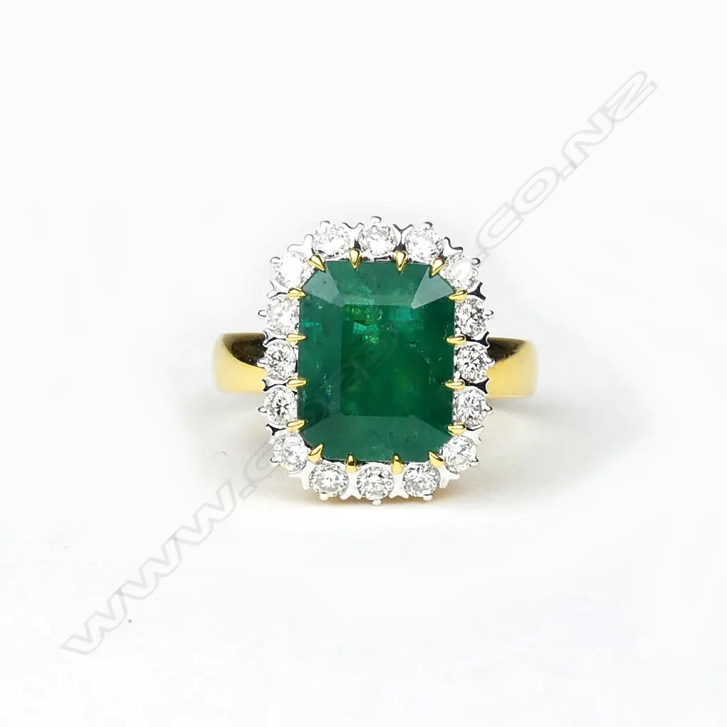 An 18ct yellow and white gold emerald and diamond ring Image 1++