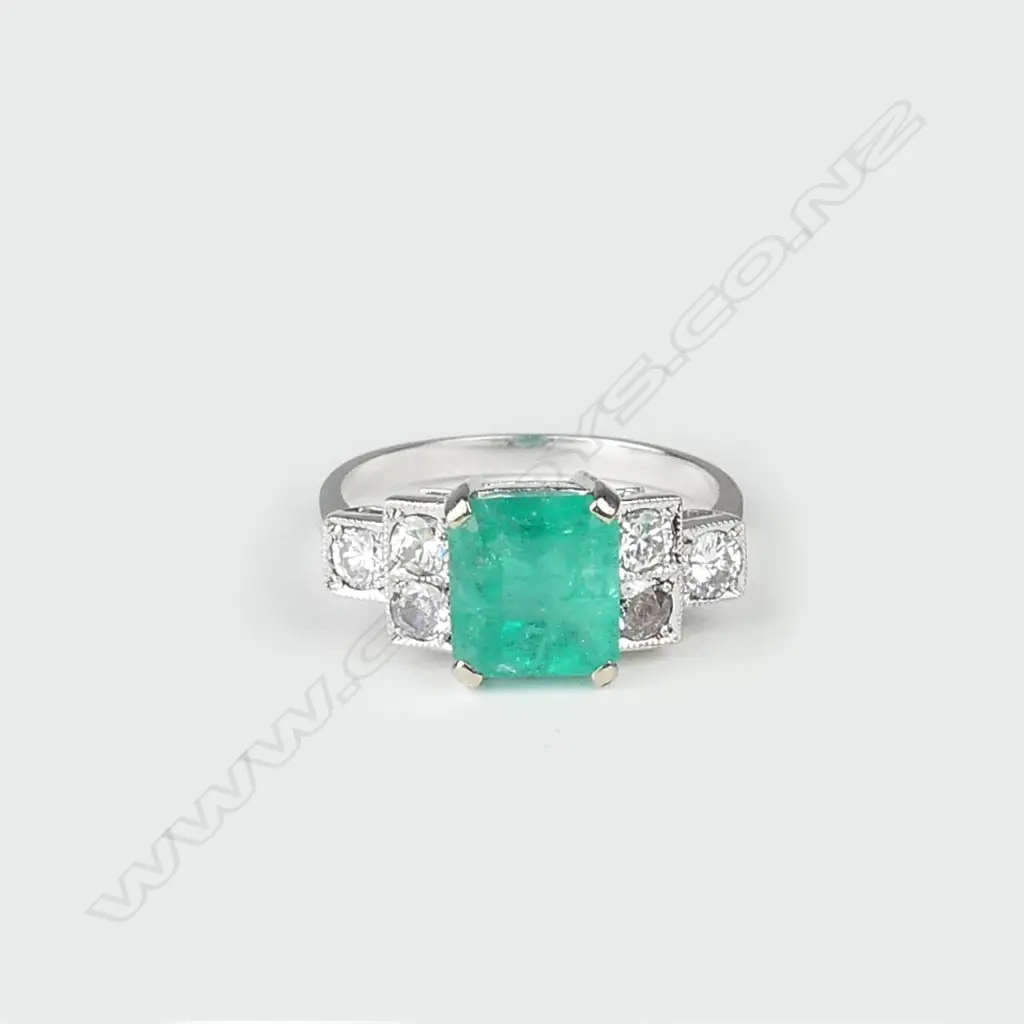 An 18ct white gold emerald and diamond Art Deco style ring Image 1++