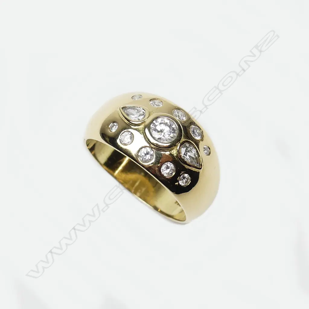 An 18ct gold and diamond dress ring Image 1++