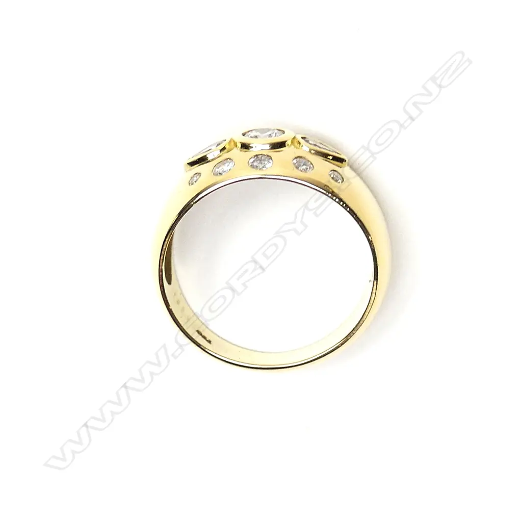 An 18ct gold and diamond dress ring Image 1++