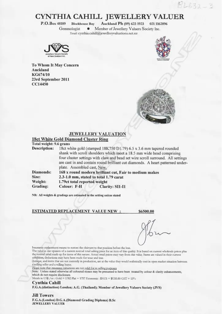 An 18ct. white gold wide multi-diamond cluster set ring Image 1++