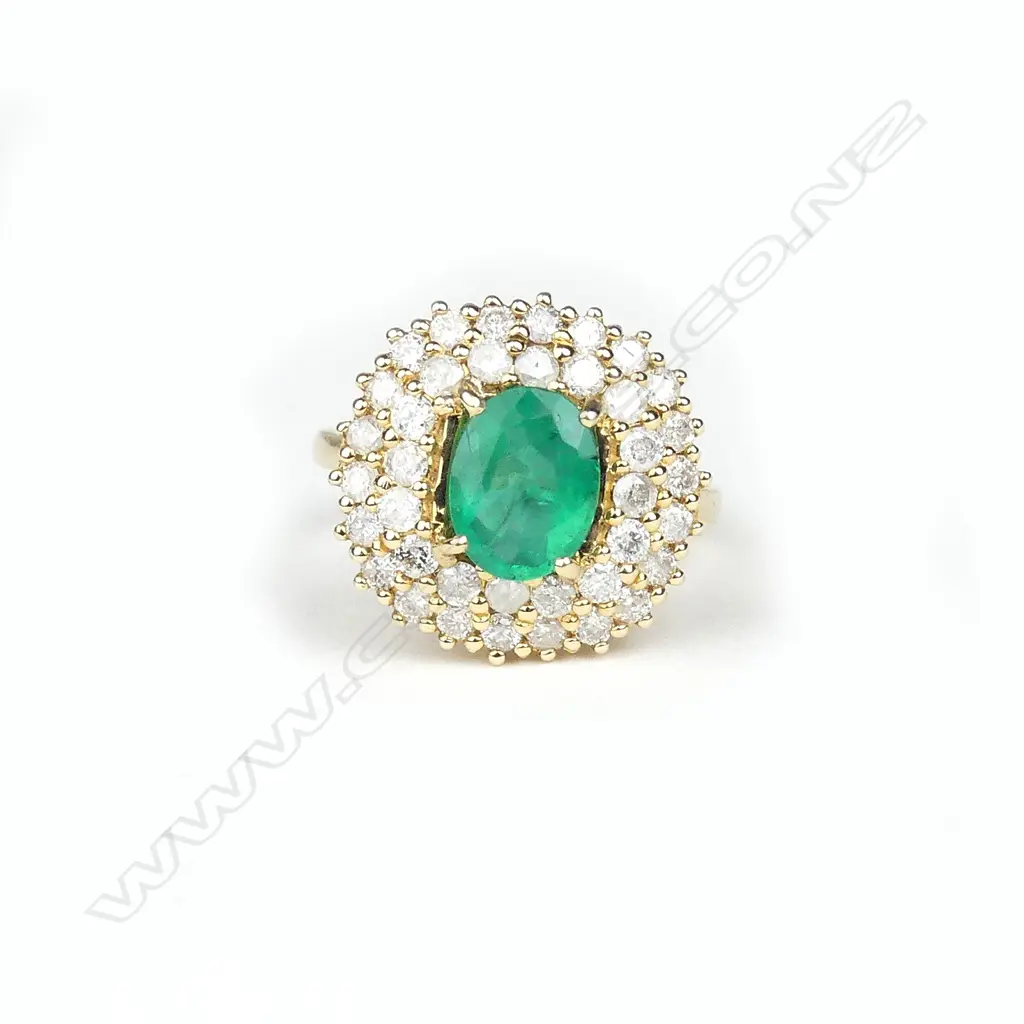 A 14ct yellow gold emerald and diamond ring Image 1++