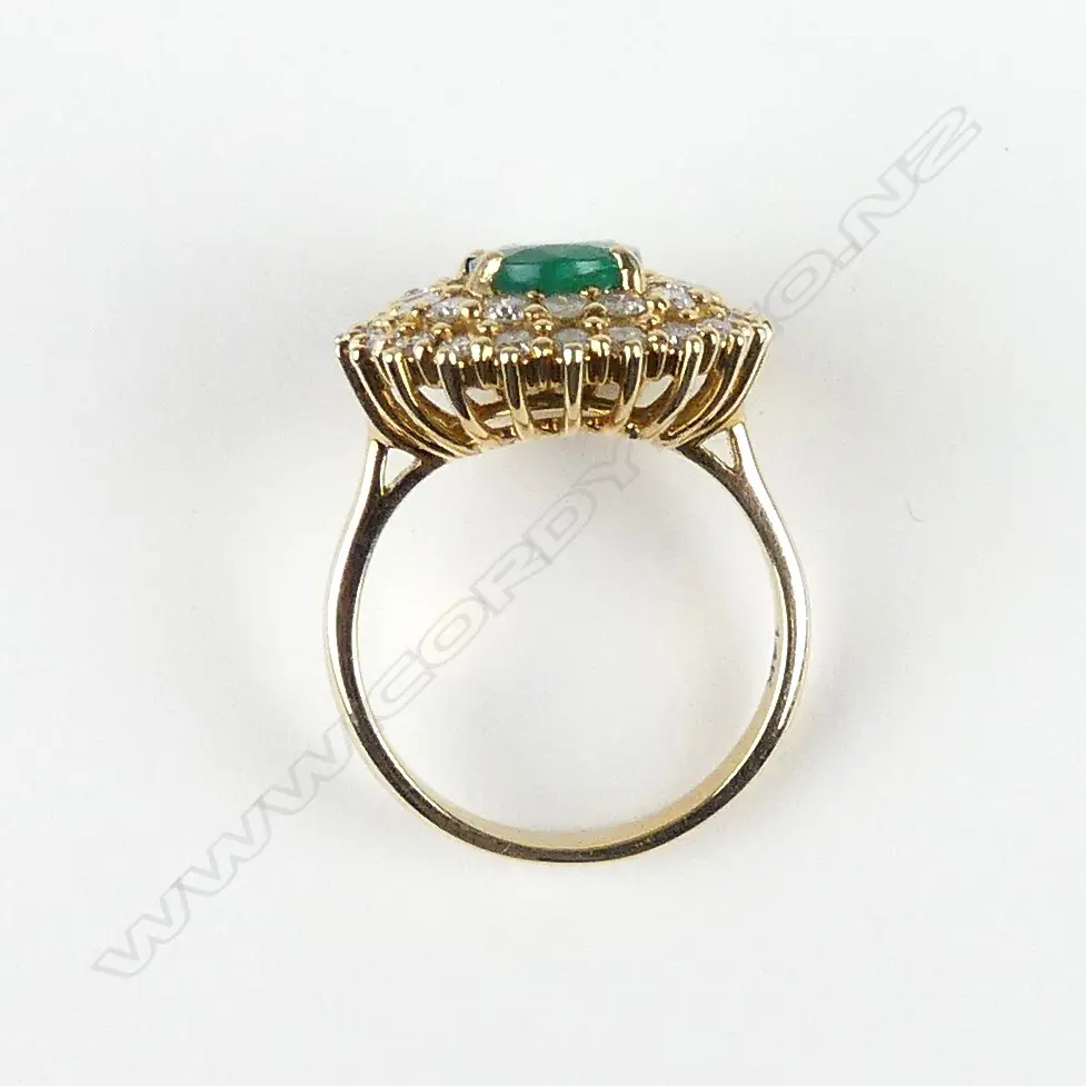 A 14ct yellow gold emerald and diamond ring Image 1++