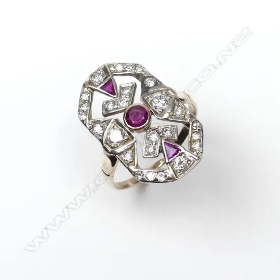 An Art Deco 9ct gold and silver diamond and ruby ring