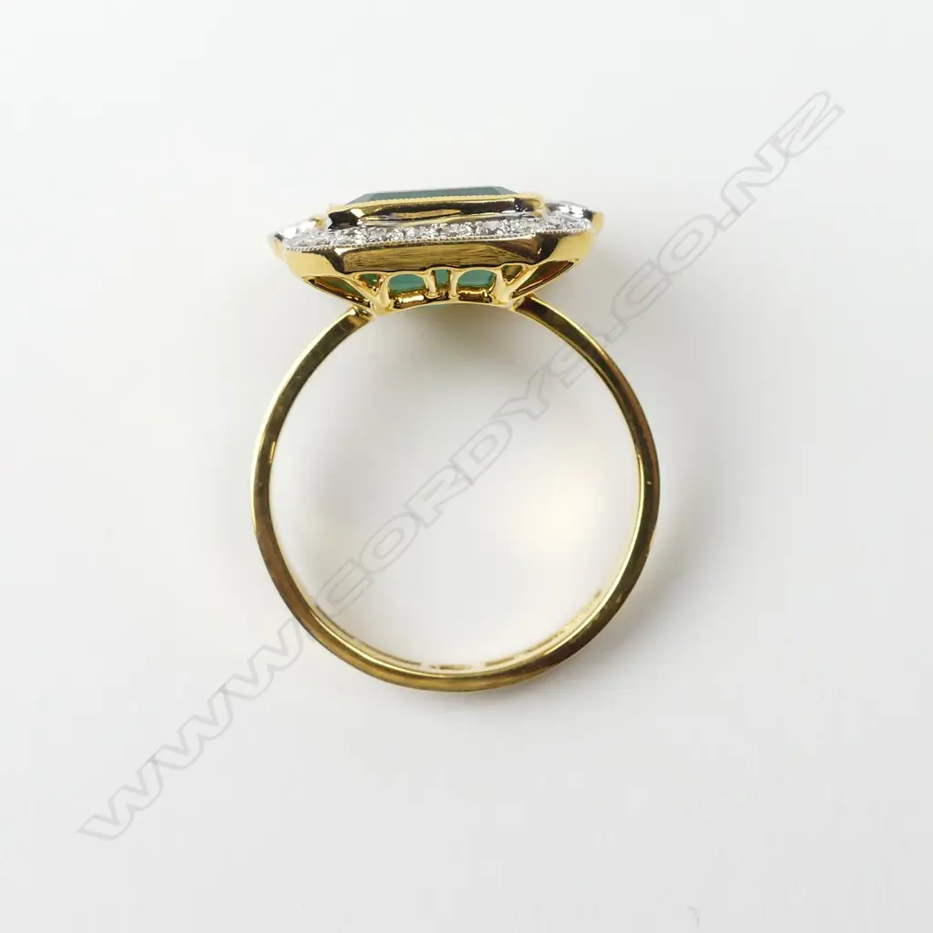 An 18ct yellow and white gold emerald and diamond ring Image 1++