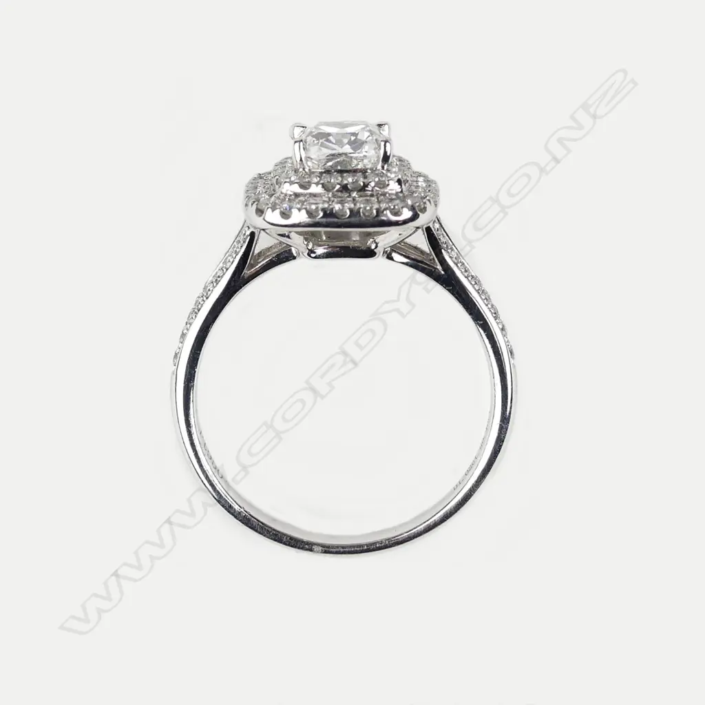 A platinum and diamond ring Image 1++