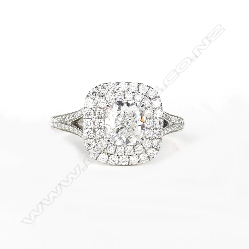 A platinum and diamond ring Image 1++