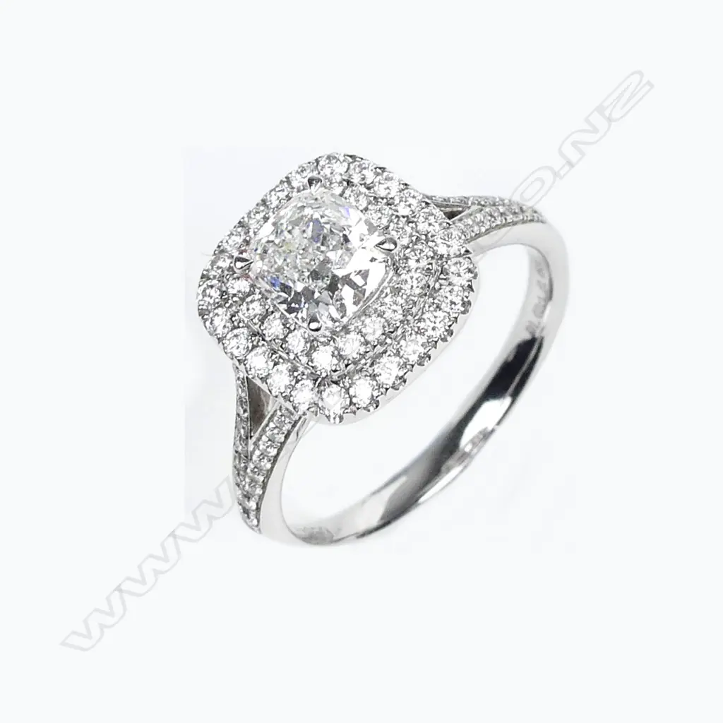 A platinum and diamond ring Image 1++