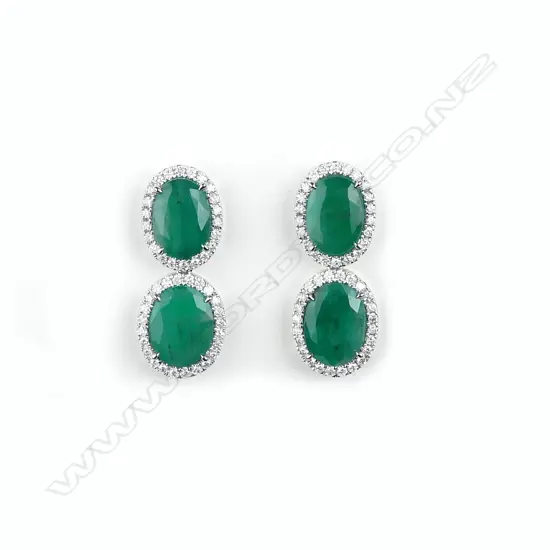 A pair of 18ct white gold emerald and diamond drop earrings