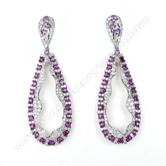 A pair of 18ct white gold ruby and diamond drop earrings