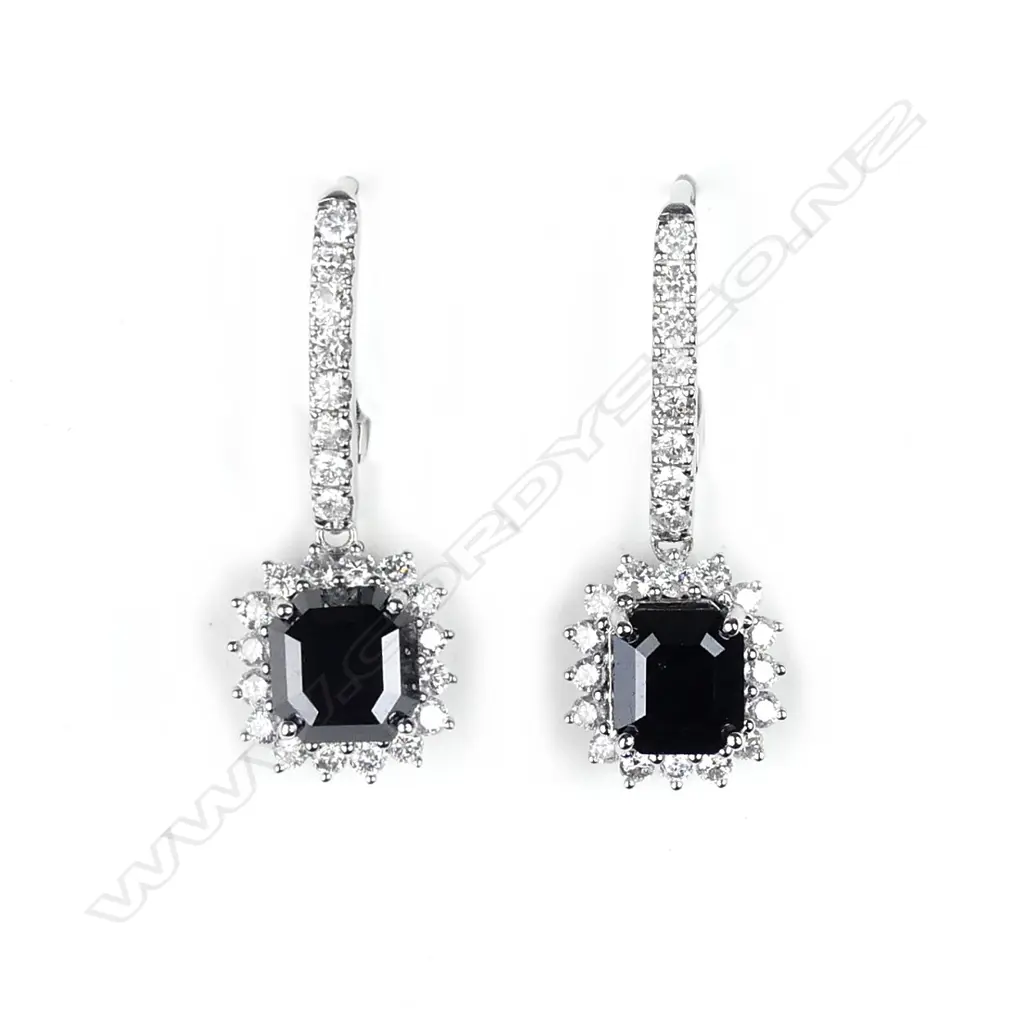 A pair of 14ct white gold and diamond earrings Image 1++