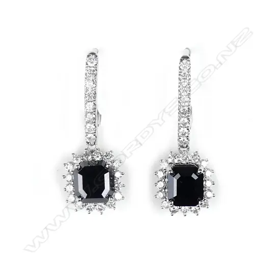 A pair of 14ct white gold and diamond earrings