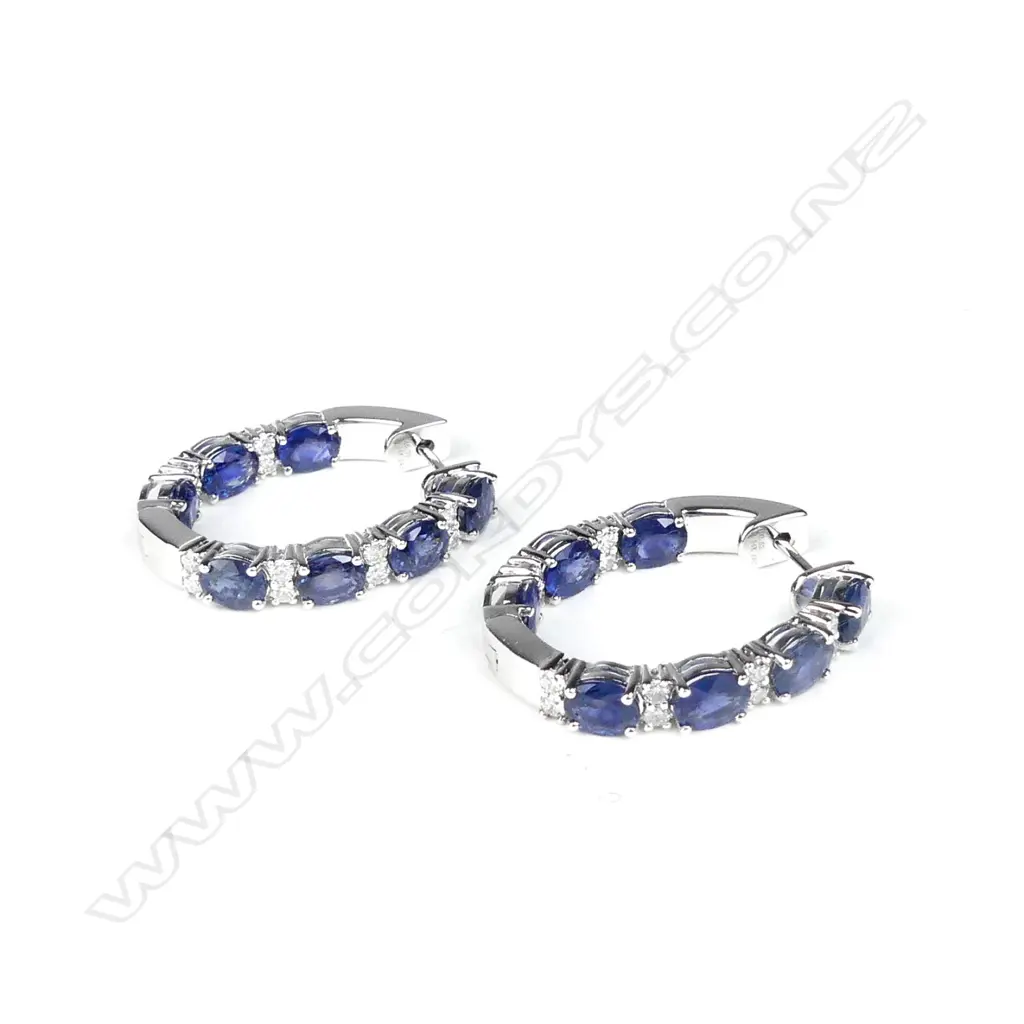 A pair of 14ct white gold sapphire and diamond hoop earrings Image 1++
