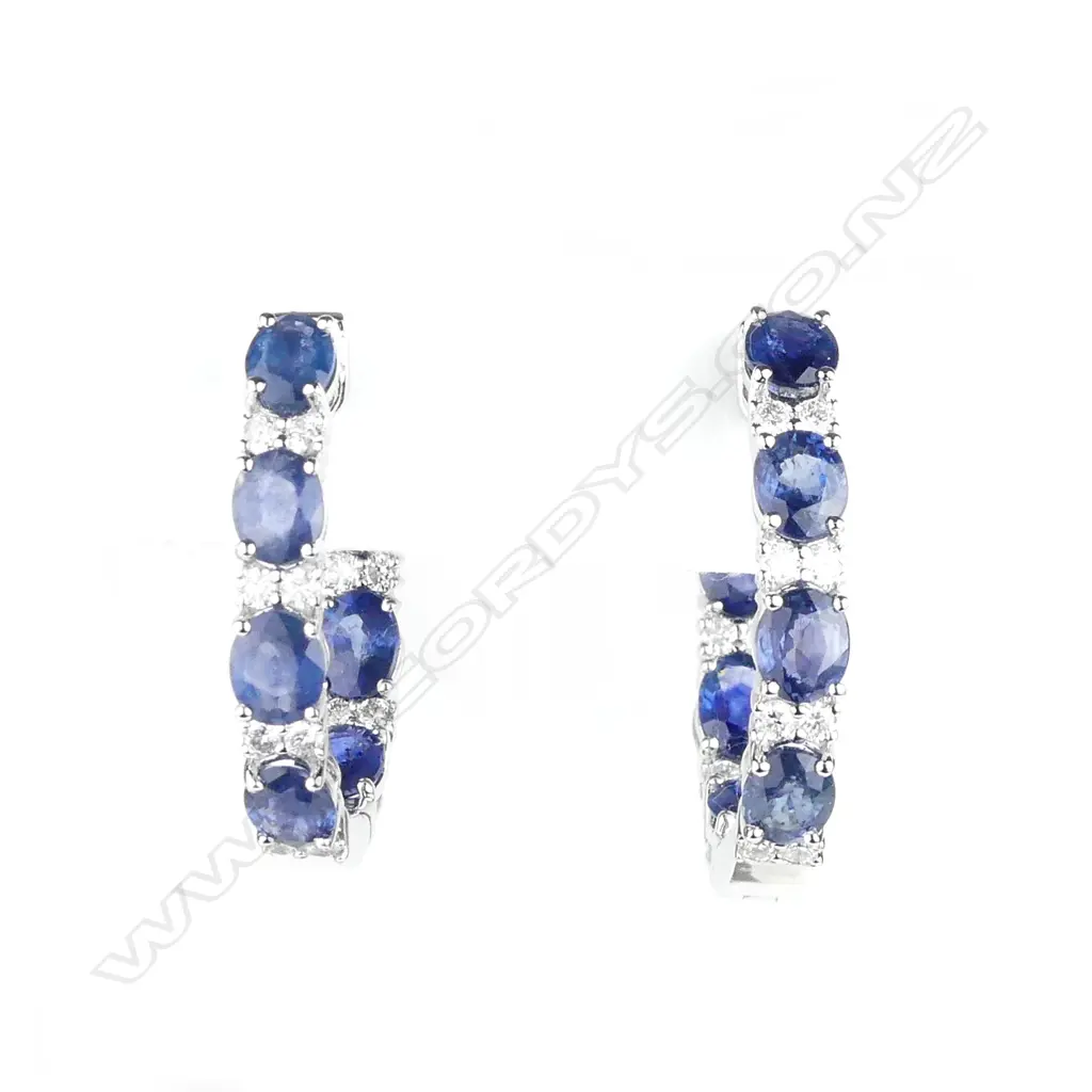 A pair of 14ct white gold sapphire and diamond hoop earrings Image 1++