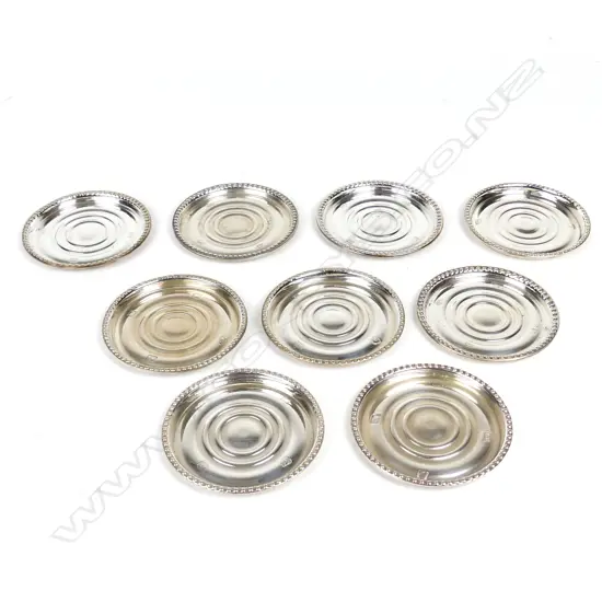 A set of nine New Zealand silver wine glass coasters