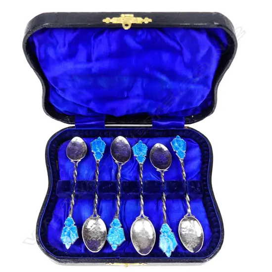 An uncommon set of six Reuben Watts Arts & Crafts silver and enamel coffee spoons