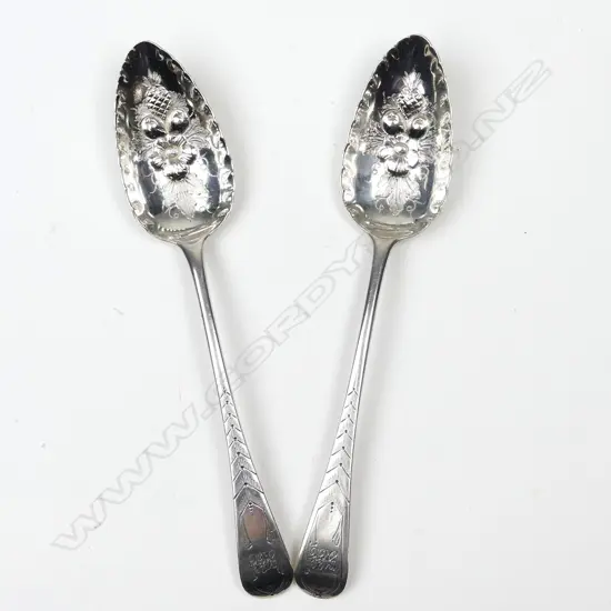 A pair of George III silver berry spoons