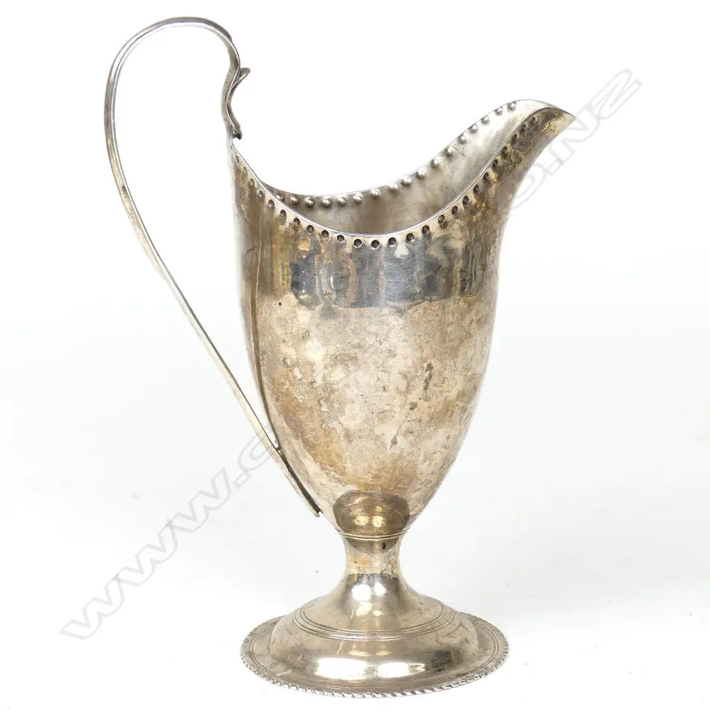 An elegant George III helmet shape cream jug Image 1++