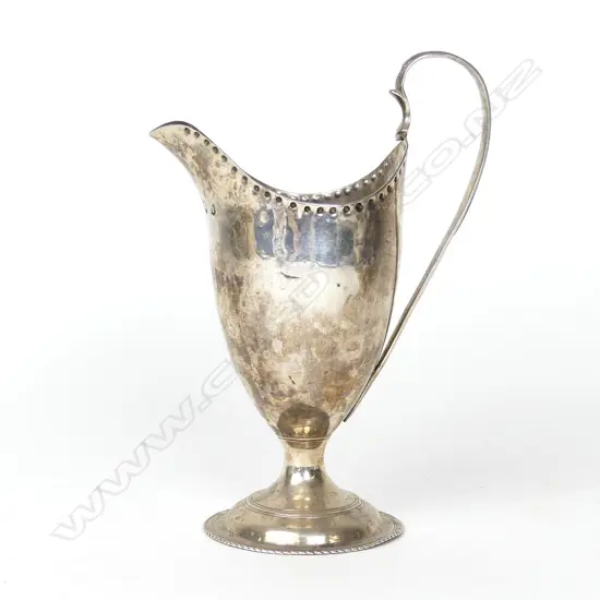 An elegant George III helmet shape cream jug