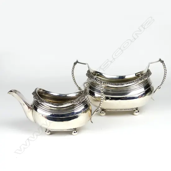 A George III silver sugar basin and milk jug