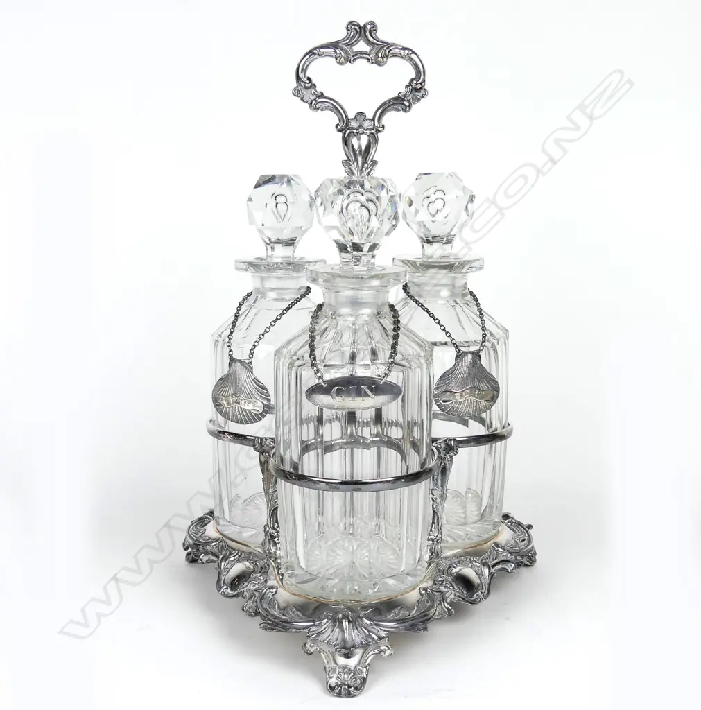 A Victorian silver plated triple decanter stand Image 1++