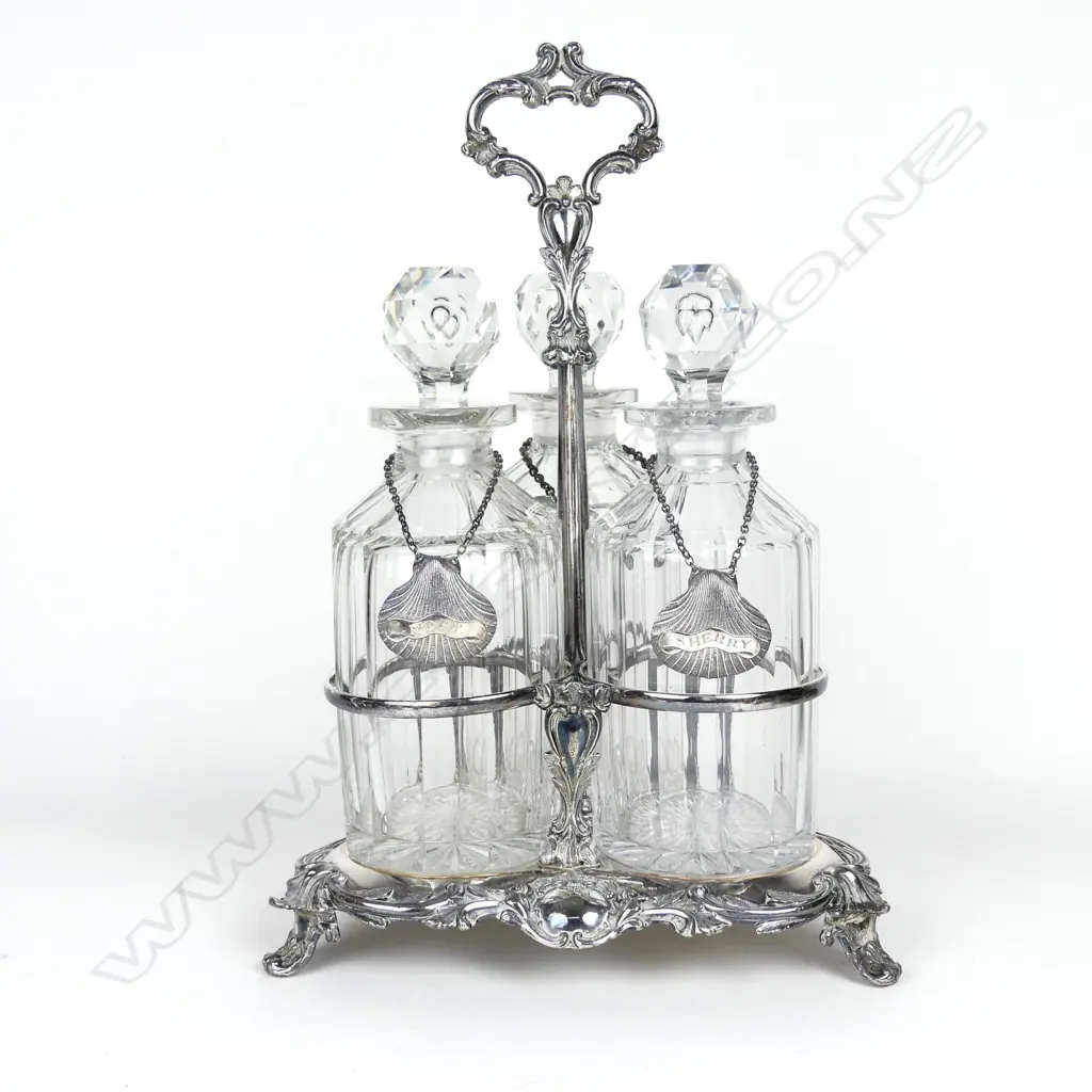 A Victorian silver plated triple decanter stand Image 1++