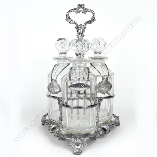 A Victorian silver plated triple decanter stand