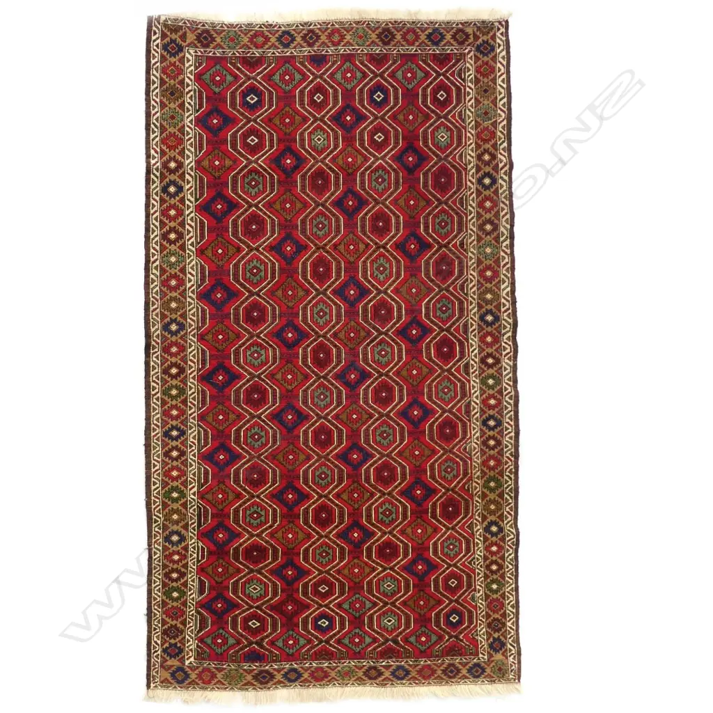 A woven Sumak rug Image 1++